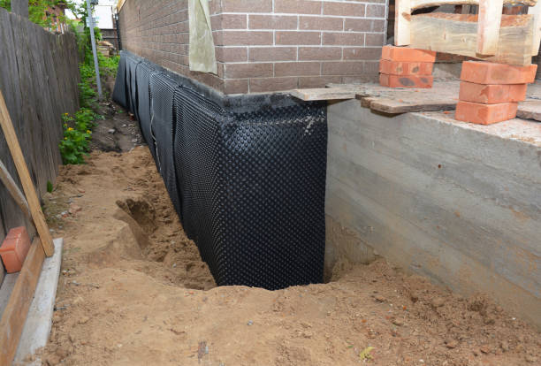 Happy homeowners after waterproofing job in Butler
